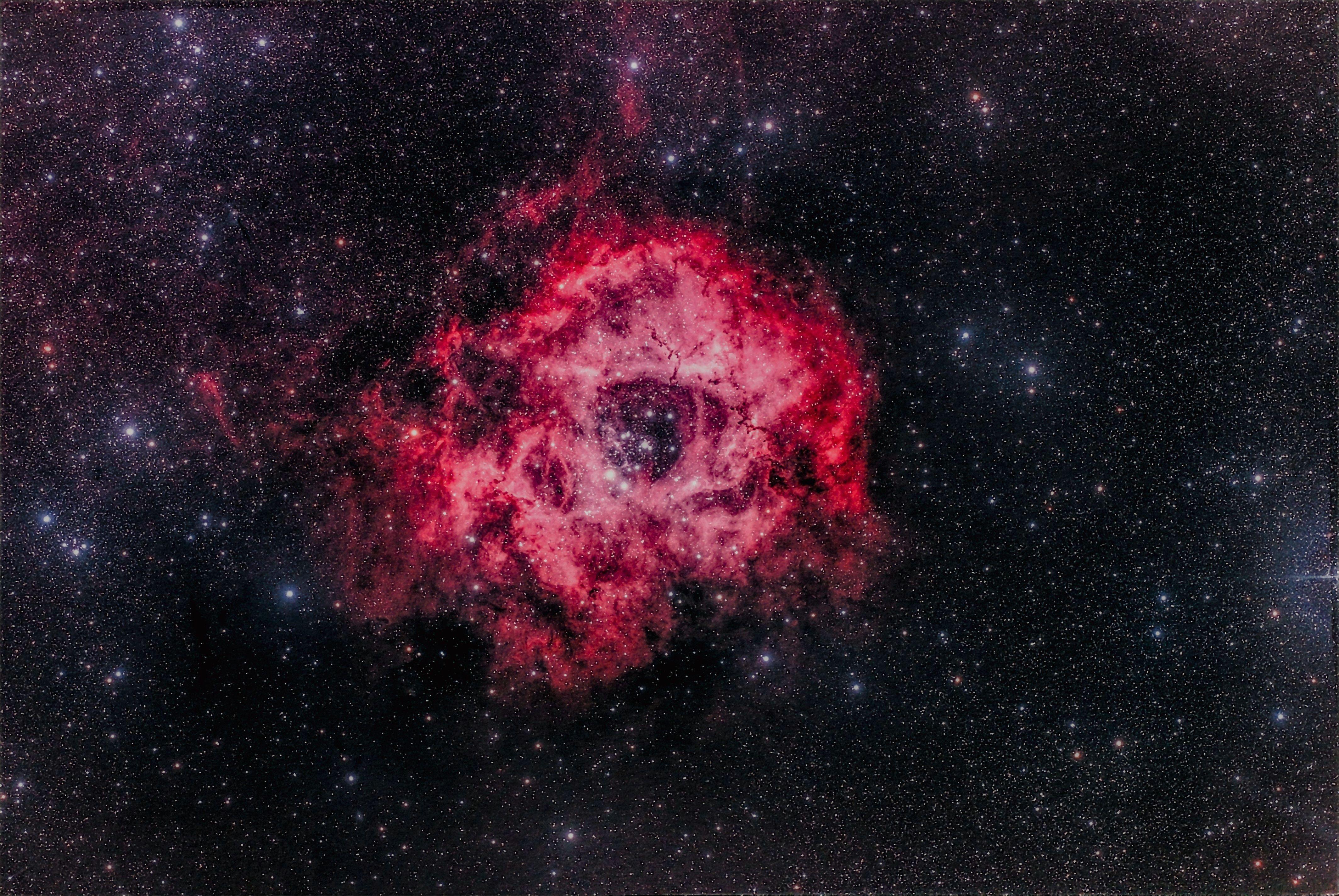 Rosetta Nebula — a cosmic backdrop of stars and glowing red clouds